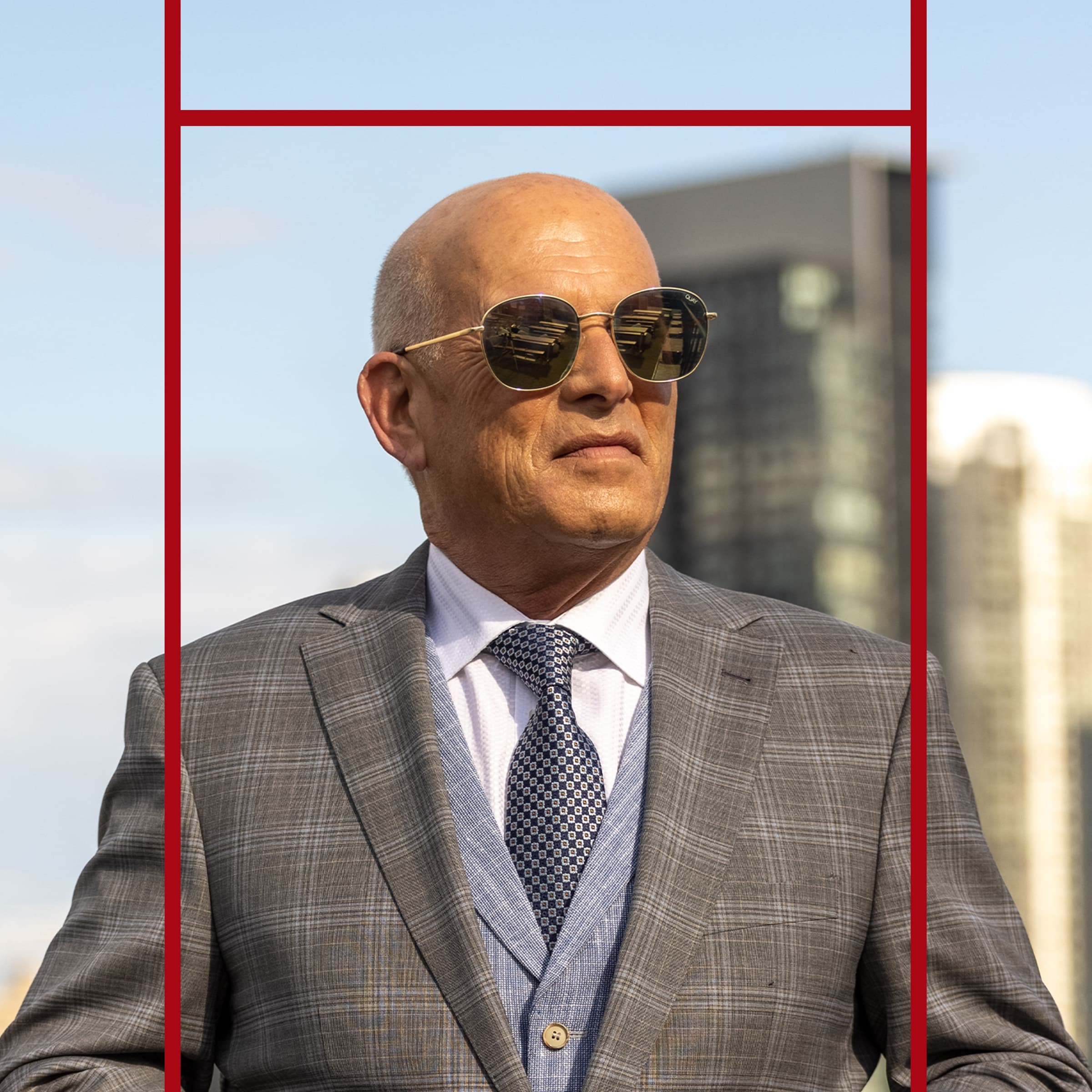 Portrait of a Hersh Realty Group principal in front of the city skyline